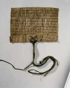 Image of King Henry II's charter of 1171 - the paper is old and brown, with elegant script