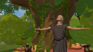 A screenshot from the Virtual Reality Oracle, showing a figure in ancient Greek robes with arms outstretched, palms up, and looking up to the sky. The figure is standing in front of a large tree with bright green leaves. 